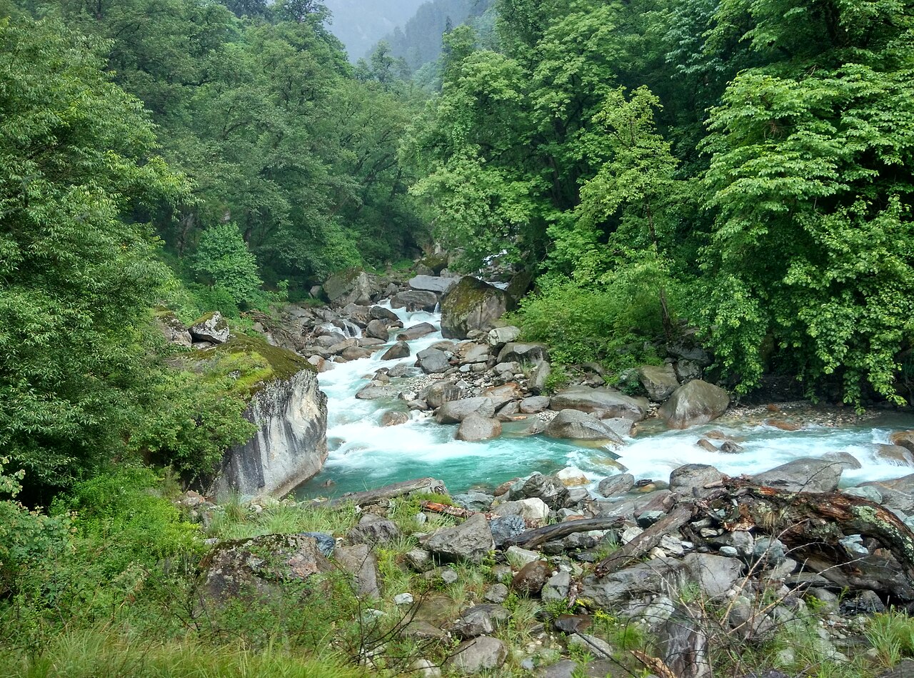 The Sainj River flowing through a rocky green valley